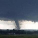 In an image made from a video taken through a car window, a tornado neared Wynnewood, Okla., on Monday.